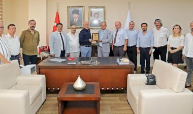 Türkiye Gazeteciler Federasyonu’ndan Başkan Gültak’a Plaket